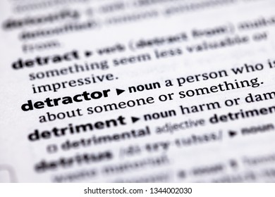 Blurred close up to the partial dictionary definition of Detractor