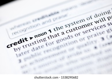 Blurred close up to the partial dictionary definition of Credit