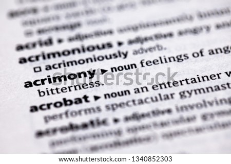 Blurred close up to the partial dictionary definition of Acrimony