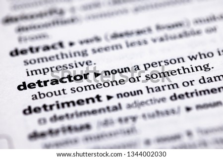 Blurred close up to the partial dictionary definition of Detractor