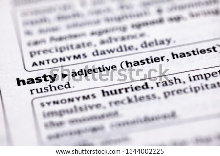 Blurred close up to the partial dictionary definition of Hasty