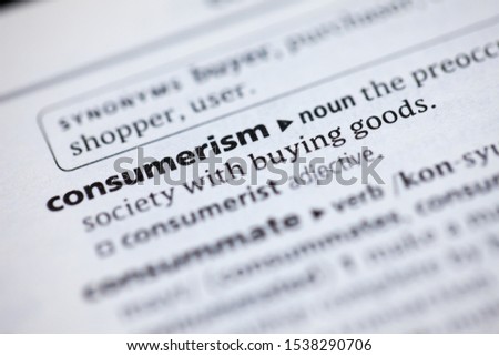 Blurred close up to the partial dictionary definition of Consumerism