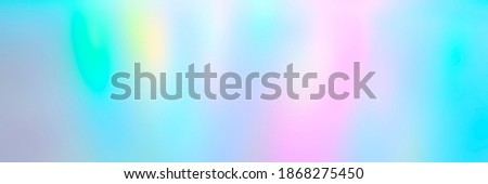 Blurred colorful multicolored background from lights. Iridescent holographic abstract bright neon colors backdrop. banner