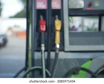 Blurred Colorful Petro Nozzles At Gasoline And Diesel Gas Station. Petro Pump Concept.