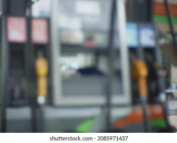 Blurred Colorful Petro Nozzles At Gasoline And Diesel Gas Station. Petro Pump Concept.