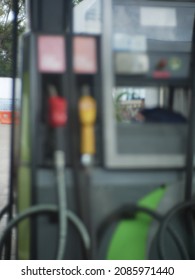 Blurred Colorful Petro Nozzles At Gasoline And Diesel Gas Station. Petro Pump Concept.