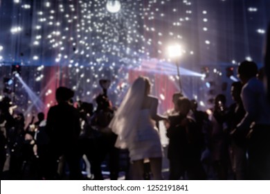 Blurred Concept Happy Groom And Bride Dancing At Wedding Party With Guest..