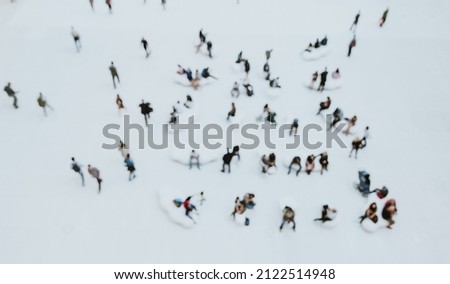 Blurred concept with a mass of people doing things. view from above