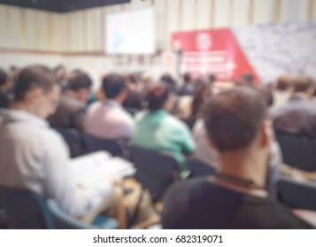 Blurred Conference Seminar Panel Discussion Audiences View Looking At Speakers In Front Of The Room