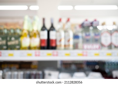 Blurred counter has a wide variety of liquor bottles that are sold in supermarkets. Blur bottles of spirits and liquor on bar counter - Shutterstock ID 2112828356