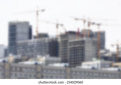 Blurred Crane And Building Construction Site As Background