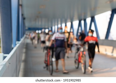 blurred Crowd of busy people with bicycles with face mask walking in Central, Hong Kong during Covid-19 - Powered by Shutterstock