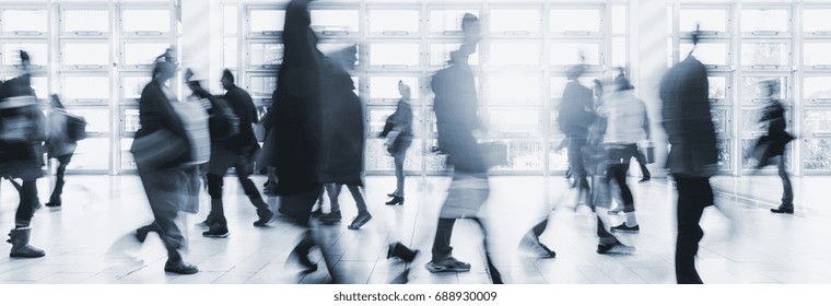 Blurred Crowd Commuting Traveling Walking In A Modern Hall