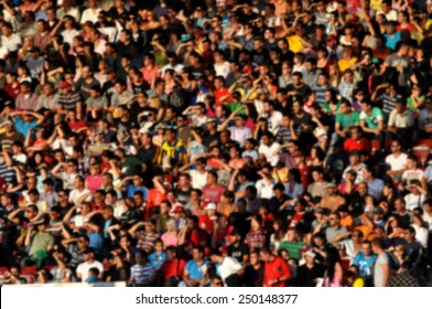 Blurred Crowd Of People At A Football Match In A Stadium