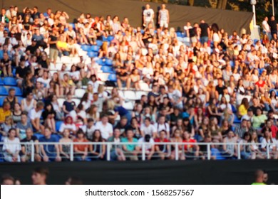 Blurred crowd of spectators on a stadium tribune at a sporting event - Shutterstock ID 1568257567