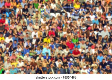 Blurred Crowd Of Spectators On A Stadium Tribune At A Sporting Event