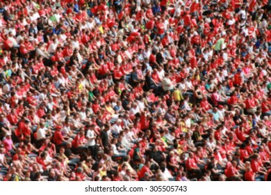 Blurred Crowd Of Spectators In A Stadium In A Football Match