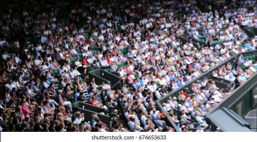 Blurred Crowd Spectators Watching The Tennis Match At Centre Court, Wimbledon. 