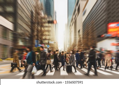 Blurred Crowd of unrecognizable business people walking on Zebra crossing in rush hour working day, blur business and people, lifestyle and leisure concept, 