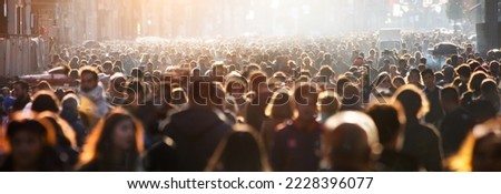 Blurred crowd of unrecognizable at the street

