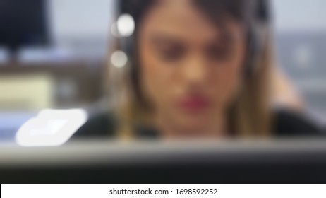 Blurred Of Customer Support Operator Working In A Call Center Online Shop Office.concept Of Marketing Since COVID 19 Outbreak.