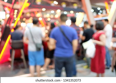 Blurred A Lot Of Customers Waiting For A Queue In Front Of The Coffee Cafe With Bokeh Light Inside The Building