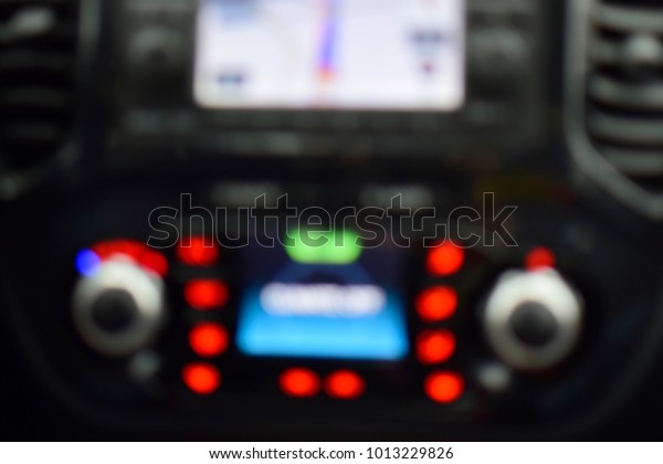 Blurred of dashboard interior car\
or blur of radio and GPS inside auto car abstract background.\
