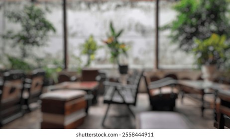 Blurred daytime view of a cozy café with wooden interiors and green plants, creating a warm, inviting ambiance. Ideal for backgrounds or design projects with a rustic charm. - Powered by Shutterstock