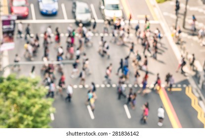 Blurred defocused abstract background of people walking on the street in Orchard Road in Singapore - Crowded city center during rush hour in urban business area zebra crossing - View from building top - Powered by Shutterstock