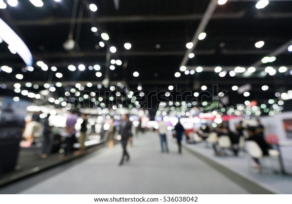 Blurred, defocused background of\
public event exhibition hall, business trade show\
concept