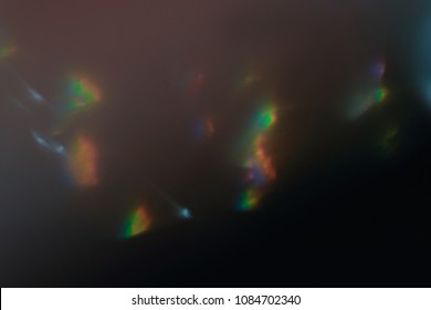 blurred defocused bright light. lens flare. shiny spots. dark background - Shutterstock ID 1084702340