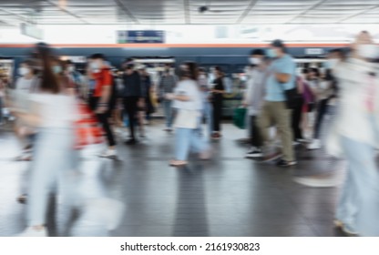 Blurred Defocused Crowd Of People Walking At The Train Station In The City