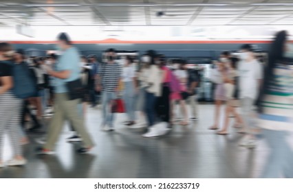 Blurred Defocused Crowd Of People Walking At The Train Station In The City