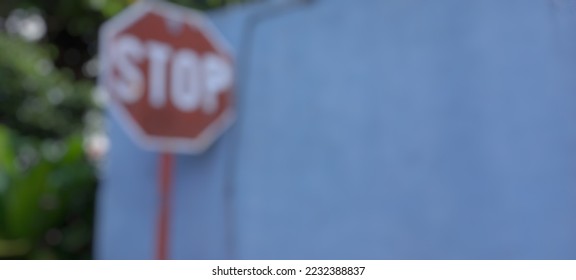 blurred and defocused image of traffic sign stop. - Shutterstock ID 2232388837