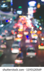Blurred Defocused Lights of Heavy Traffic on a Wet Rainy City Road at Night
