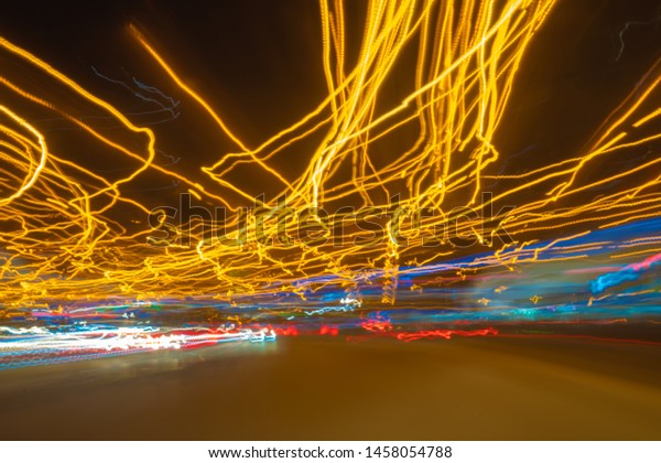 Blurred Defocused Lights of Heavy Traffic on
a Wet Rainy. traffic lights in motion
blur.