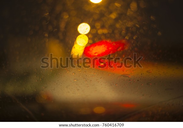 Blurred\
Defocused Lights with blurred rain drop on\
glass