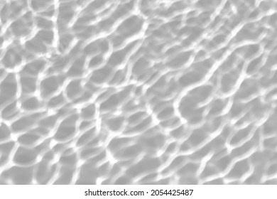 Blurred defocused water texture overlay effect for photo and mockups. Organic drop diagonal shadow and light caustic effect on a white wall. Shadows for natural light effects - Shutterstock ID 2054425487