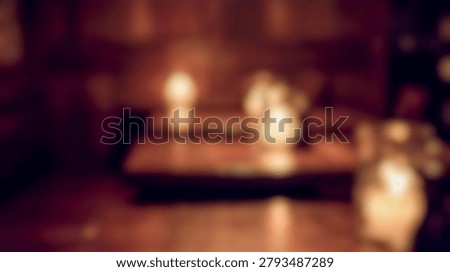 blurred defocussed background featuring dark moody pub interior with warm glowing bokeh lights, empty wooden dining tables creating cozy night restaurant atmosphere, perfect abstract backdrop