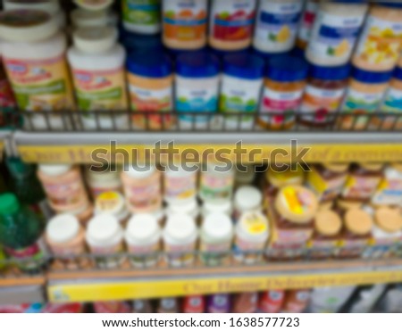 blurred display rack inside super markets selling branded products