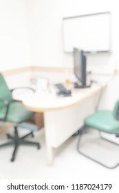 Blurred Doctor Examination Room For Patient Exam In OPD Ward For Abstract Background . Blurry Empty Physician Desk For Diagnosis Sick People Working Space In Healthcare Medical Hospital.