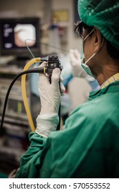 Blurred Of Doctor Insert  Bronchoscope To Patient