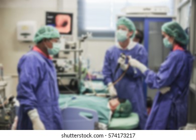 Blurred Of Doctor Insert Bronchoscope To Patient