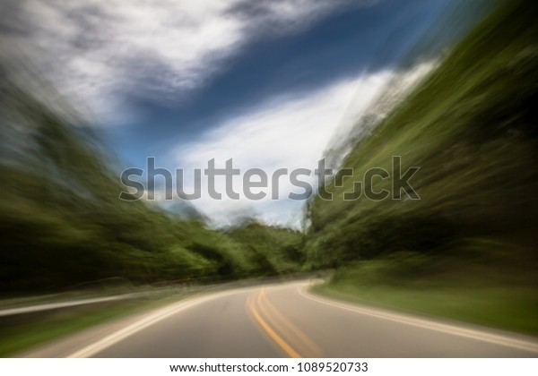 Blurred and double vision while driving with
view of the road and feeling of
speed.
