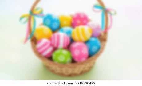 Blurred Easter Wicker basket full of vibrant painted eggs with ribbon.