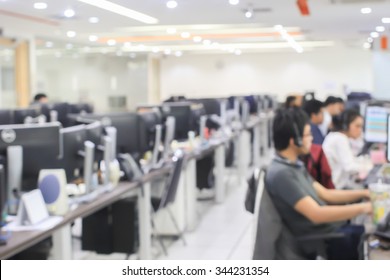 blurred of employee working call centre hotline at office computer indoor room concept.