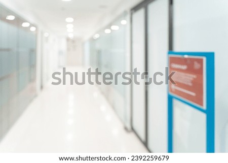 Blurred empty open space corridor. Abstract light bokeh at office interior background for design. High quality photo