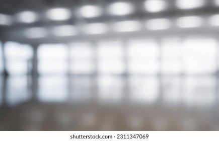 Blurred empty open space office. Abstract light bokeh at office interior background for design and table - Shutterstock ID 2311347069