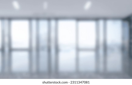 Blurred empty open space office. Abstract light bokeh at office interior background for design and table - Shutterstock ID 2311347081