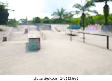 Blurred empty street skating in open skate Park.Extreme skating in a concrete skatepark outside.Skateboarder does an extreme sport.unfocused - Powered by Shutterstock